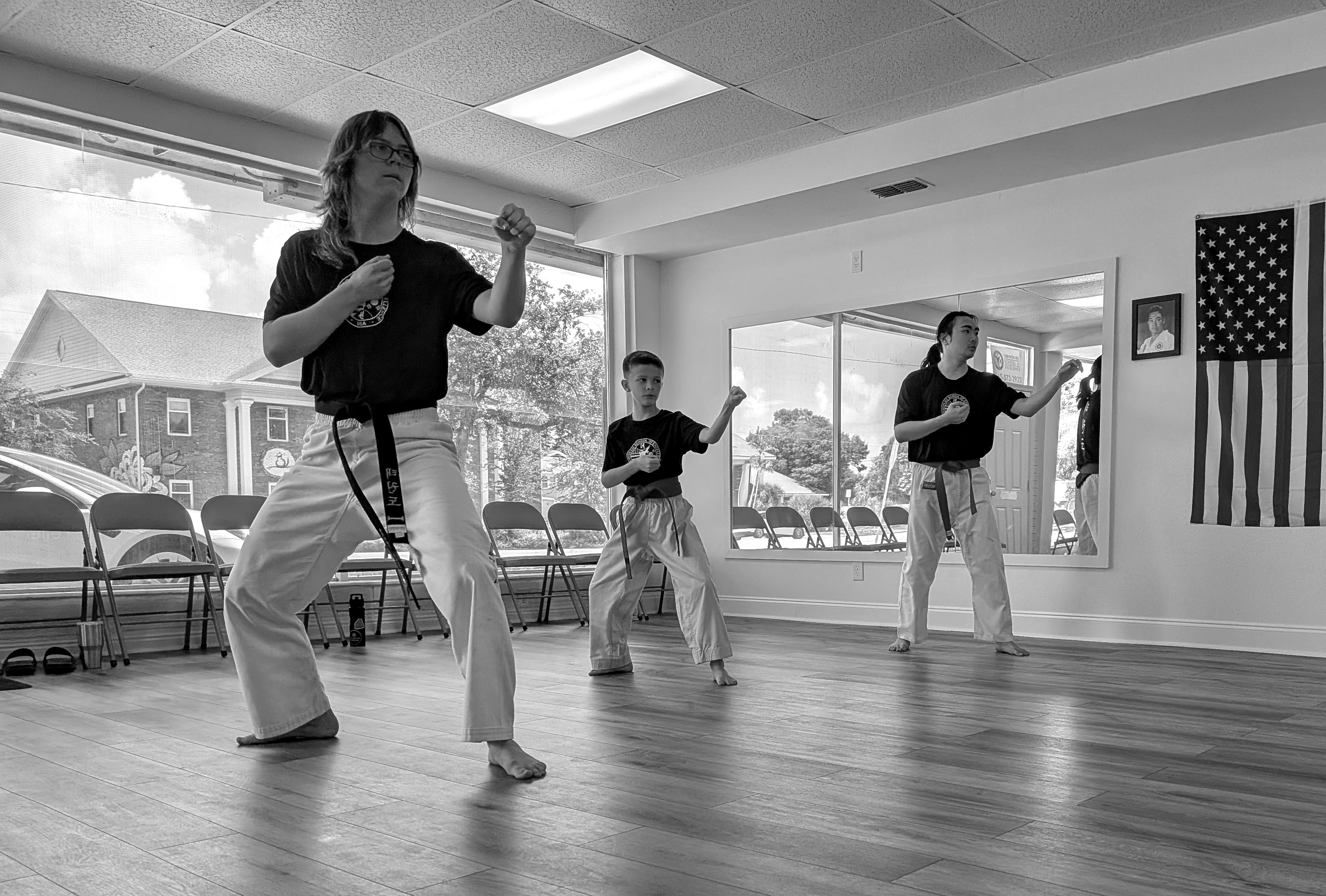 3 students performing the Maki stance